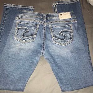 Silver distressed boot cut jeans